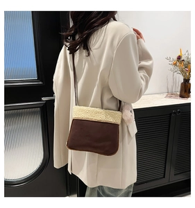 Detail of vintage plush crossbody bag with brown suede and fleece material shown on model