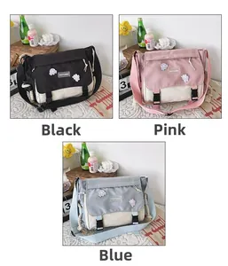 Three-color macro view of large canvas messenger bags in black, pink, and blue finish