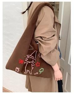 Brown plush tote bag with colorful dog embroidery and Happy Time text on model