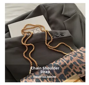 Detail of leopard print flap bag with gold chain strap and square metal lock closure