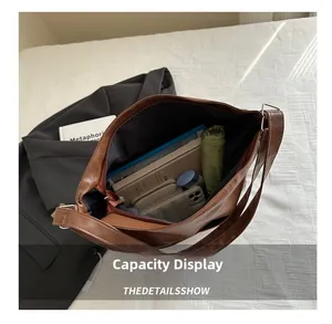 Interior view showing large capacity for tablet and daily items in brown tote bag