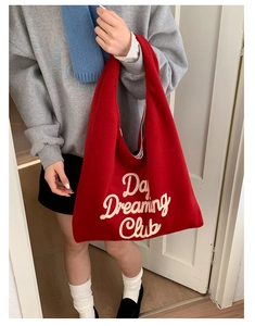 Detail of red plush tote bag with Day Dreaming Club embroidery and large capacity