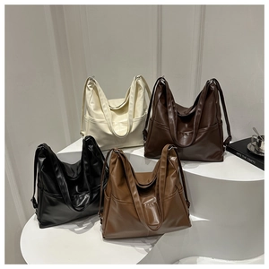 Detailed view showing four colors of retro large capacity tote bags on minimalist stand