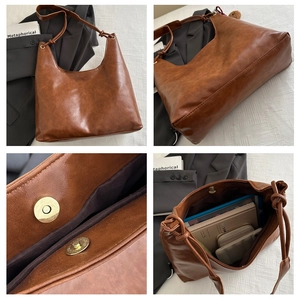 Detail of vintage caramel leather tote with magnetic buckle and large storage space