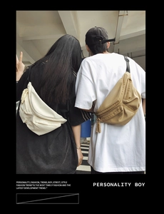 Detail of neutral crossbody chest bags in cream and khaki featuring waterproof nylon fabric