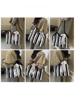 Multiple views of a striped canvas tote bag with a white lace bow and large capacity