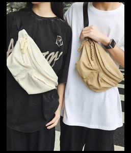 Close-up of functional zipper pockets on nylon sling bags for urban streetwear style