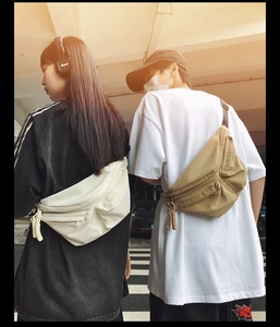 Outdoor view of multi-pocket utility chest bags in beige and khaki techwear style