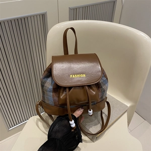 Retro plaid patchwork backpack with brown leather trim and fashion logo lettering