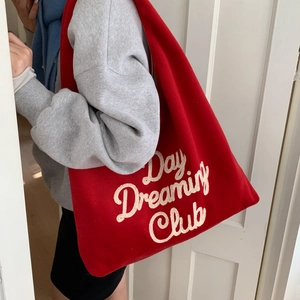 Red plush tote bag with Day Dreaming Club embroidery for casual commute or students