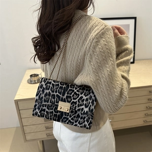 Stylish leopard print crossbody bag with gold chain strap and metallic lock closure