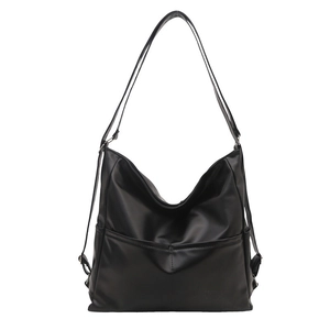 Classic black vintage tote backpack with multi-pocket design and glossy finish
