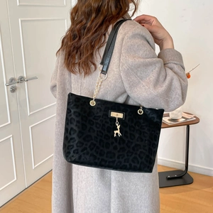 Retro black leopard print tote bag with chain strap and golden deer pendant detail