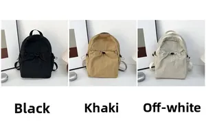 Three-color display of nylon drawstring backpacks in black, khaki, and cream beige