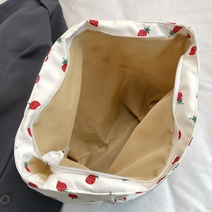 Spacious white nylon tote bag with strawberry print and white zipper closure system