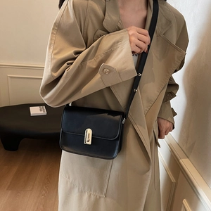 Minimalist black square leather shoulder bag for women with silver metal buckle detail