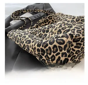 Close-up of leopard print tote bag showing thick jacquard woven fabric texture
