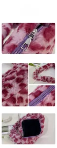 Detail of the purple leopard plush bag showing the smooth zipper and fuzzy faux fur texture