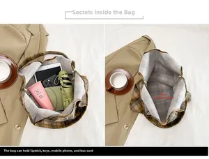 Spacious main compartment of the vintage plaid tote bag showing daily essentials inside