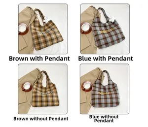 Detail view of retro plaid tote bag with letter embroidery and star charm accessory