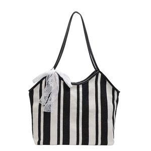 Classic retro black and white striped canvas tote bag with elegant white lace bow decoration