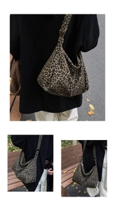 Detail view of large leopard print hobo bag with adjustable wide strap and canvas texture
