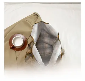 Detail view of the spacious inner compartment of this vintage plaid tote bag