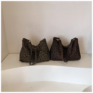 Detail showing two leopard print tote bags in light and dark brown canvas textures