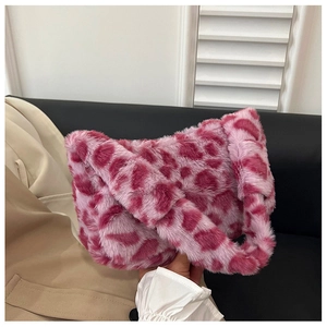 Detail of soft pink leopard print faux fur shoulder bag with plush fluffy texture