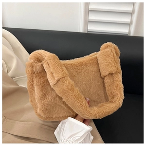 Detailed view of plush brown faux fur shoulder bag with soft texture and matching handle