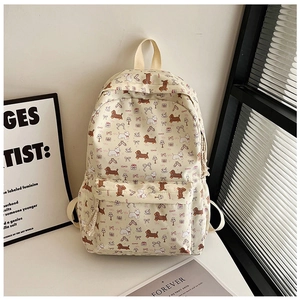 Détail du motif floral teckel mignon sur un sac à dos en toile crème avec poche avant