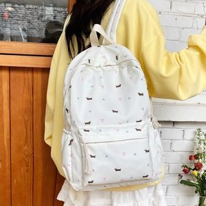 Sac à dos blanc avec imprimé teckel et fleurs, style écolière et poches latérales