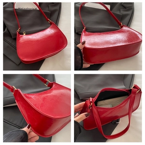 Detailed views of red patent leather crescent bag with cracked texture and gold hardware