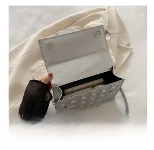 Interior view showing the capacity of the quilted chain crossbody bag for wallet and phone
