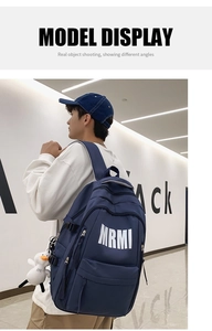 Deep blue large capacity student backpack featuring white MRMI logo and duck pendant