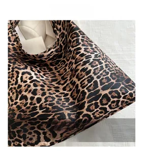 Close-up detail of high-quality leopard print material on a large tote bag for women