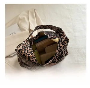Leopard print tote bag interior showing large capacity for umbrella, wallet and phone