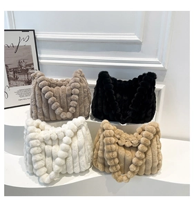 Detail showing plush faux fur tote bags in four colors with thick vertical quilted texture
