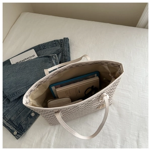 Top-down view of spacious tote interior with letter print showing large capacity for essentials