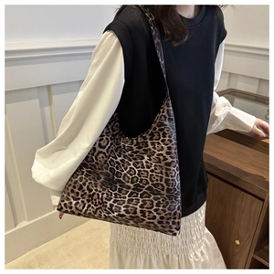 Fashionable leopard print tote bag shown on model highlighting large capacity and soft texture