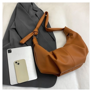 Brown lychee texture PU leather shoulder bag with stylish knotted strap detail and large capacity