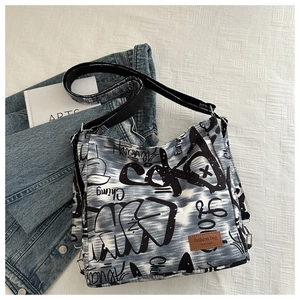 Macro view of canvas bag with graffiti lettering and Fashion bag NEW YORK leather label