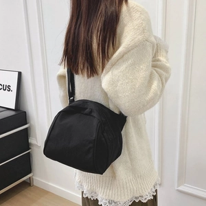 Retro black canvas crossbody bag with adjustable strap for women in minimalist style