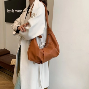 Caramel lychee grain PU leather half-moon bag with soft folds and wide shoulder strap