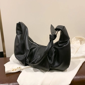 Chic black pleated dumpling bag in lychee texture leather for casual shoulder or crossbody wear
