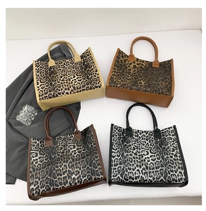 Detailed view of large leopard print tote bags in four edge colors for autumn fashion