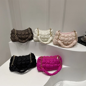Minimalist quilted nylon cloud shoulder bag shown in five vibrant modern colors