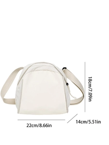 Detailed view of cream canvas crossbody bag showing dimensions 22cm x 18cm x 14cm