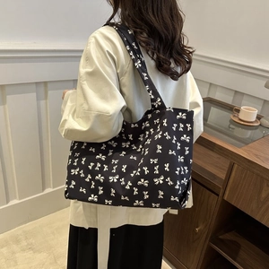 Large black canvas tote bag with white bow print patterns for women autumn 2025 fashion