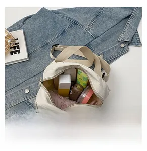 Internal view of canvas messenger bag showing storage space for umbrella and cosmetics